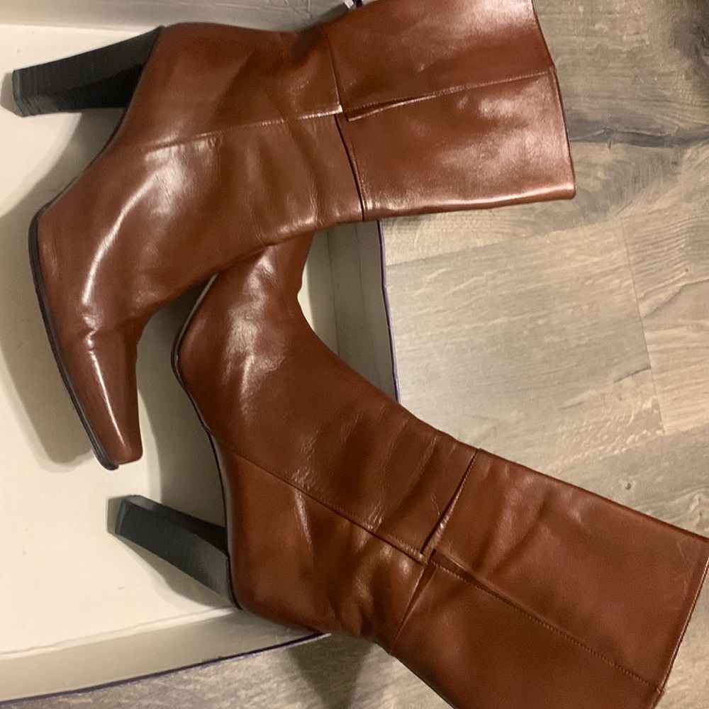 Chestnut calf Stuart Weitzman boots.